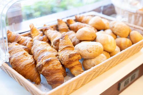 a display case in a bakery with pastries and bread at Toyoko Inn Hokkaido Sapporo Susukino Kosaten in Sapporo