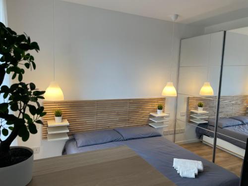 Ένα ή περισσότερα κρεβάτια σε δωμάτιο στο Saronno Urban Chic - Affitti Brevi Italia