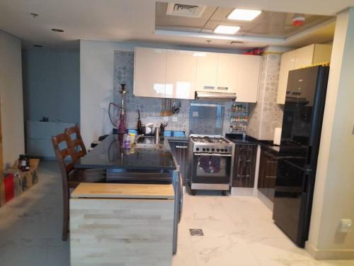 a kitchen with a sink and a stove top oven at a chilled place in Dubai
