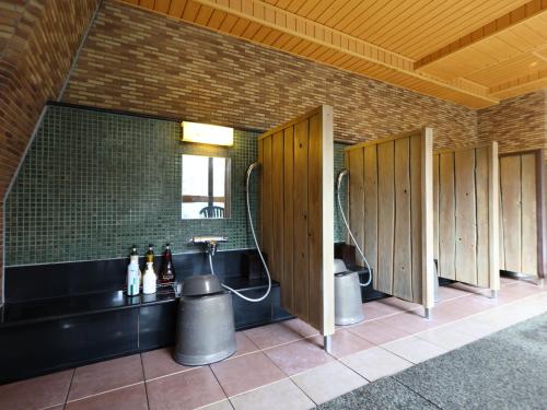 a row of stalls in a public restroom at Dormy Inn Takasaki in Takasaki