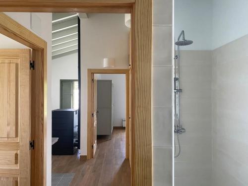 a bathroom with a walk in shower and a walk in shower at Casa Rural Monte Zarro in Cudillero