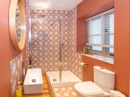 a bathroom with a shower and a toilet and a sink at A Hidden Gem in the Heart of Wells, Somerset in Wells