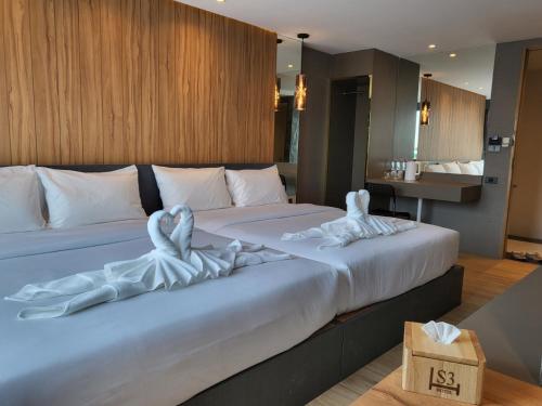 Katil atau katil-katil dalam bilik di S3 Siam Bangkok Hotel