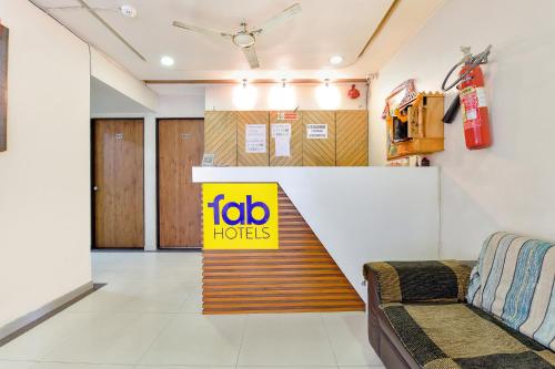 a lobby with a job horizons sign on the wall at FabHotel Crystal - Nr Odau Ring Road in Ahmedabad