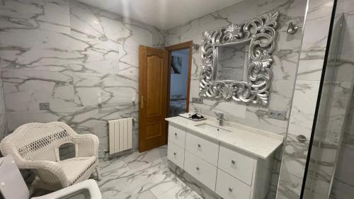 a bathroom with a sink and a mirror at Sunny Florida in Torrevieja