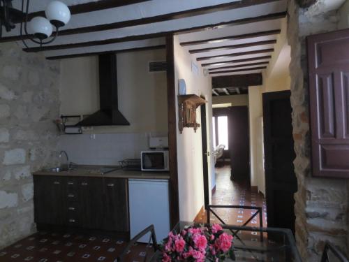Una cocina o cocineta en Apartamentos Turísticos El Losal
