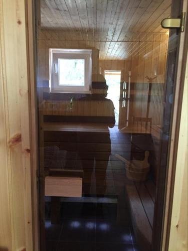 a room with a piano inside of a house at Nyugalmas 2 Vendégház Lénárddaróc in Lénárddaróc