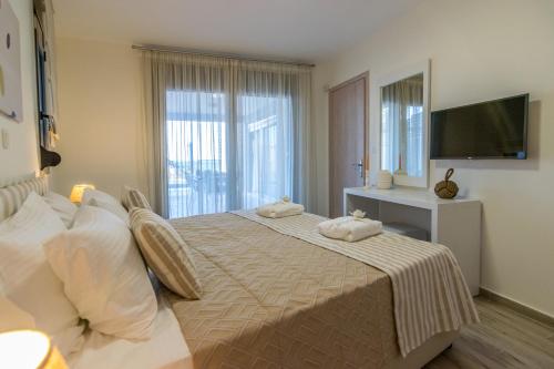 Letto o letti in una camera di Villa Ilianthos