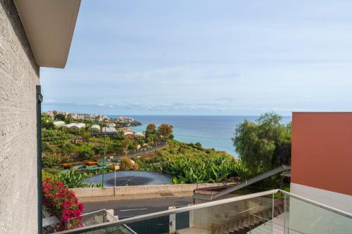 a view of the ocean from a balcony of a resort at Villa das Quebradas by An Island Apart in Funchal