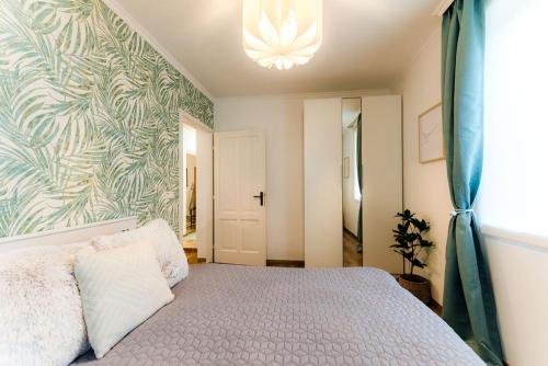 Postel nebo postele na pokoji v ubytování Birdie apartman