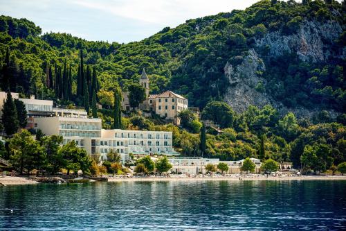 a resort on the shore of a body of water at TUI BLUE Adriatic Beach - Adults Only - All Inclusive in Igrane
