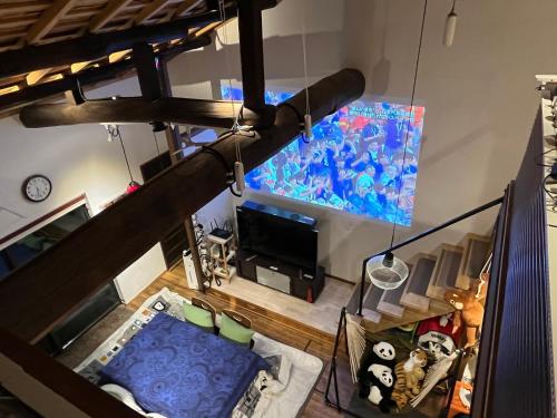 an overhead view of a living room with a television at Nishijin no Sato 西陣之郷 -100 yrs Smart & Sustainable AI Arthouse with 10Gbps wifi - in Kyoto