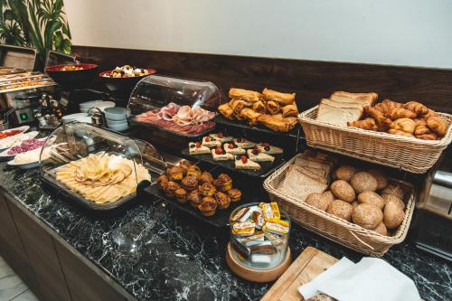 a buffet with many different types of food on a counter at MARK Hotel in Belgrade