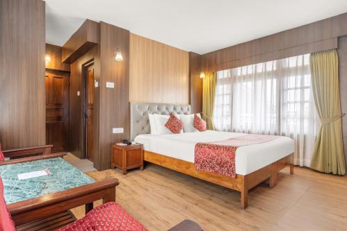 Postel nebo postele na pokoji v ubytování Summit Tashi Ghang Heritage Resort
