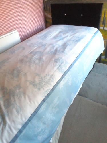 a close up of a bed in a room at Homestay Cardiff in Cardiff