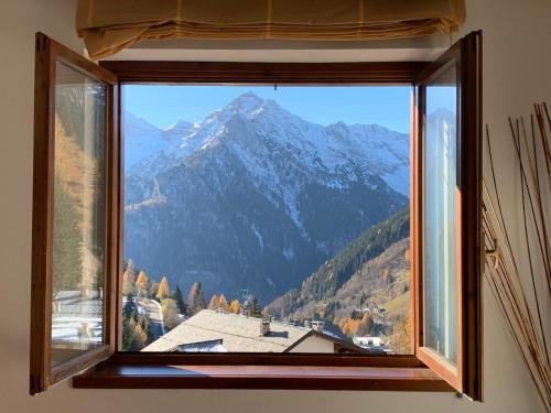 a window with a view of a mountain at Chez Nous in Foppolo