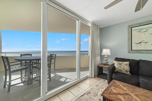 a living room with a couch and a table at Perdido Sun 904 in Perdido Key