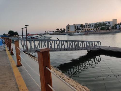 a bridge over a body of water with boats at Hawana Salalah Laguna Studio in Salalah