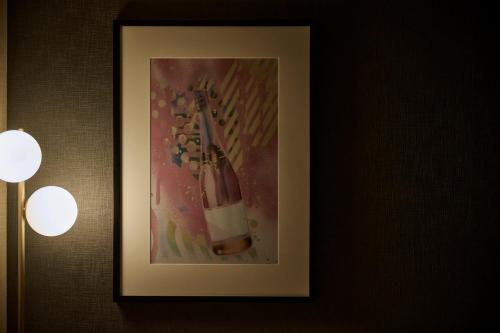 a picture of a painting of a knife on a wall at The Royal Park Canvas Ginza Corridor in Tokyo