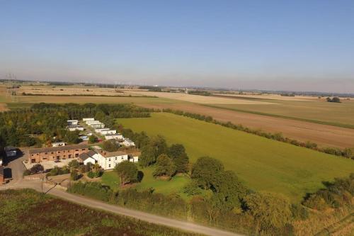 an aerial view of a house in a field at Beautiful 4 Bedroom Cottage - Cottage 4 in Doncaster