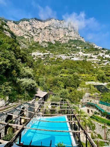 a view of the table mountain from the pool at Villa Alba d'Oro - Historic luxury villa in Amalfi