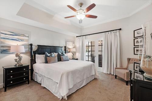 a bedroom with a bed and a ceiling fan at Phoenix West 2005 in Orange Beach