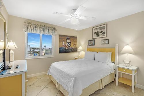 a bedroom with a bed and a window at SeaSpray West 603- Gulf Front in Perdido Key
