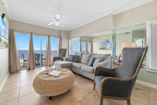 a living room with a couch and a table at Tidewater 609 in Orange Beach