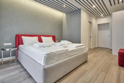 Postel nebo postele na pokoji v ubytování Olimp Hotel