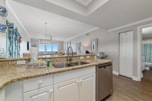 a kitchen with a sink and a counter top at Windemere 1003 in Perdido Key