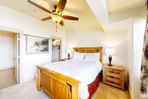 a bedroom with a bed and a ceiling fan at Oslo Lane Ski Townhouse in Park City