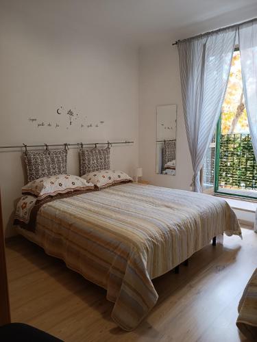 a bedroom with a large bed and a window at Il Torrione in Guardiagrele