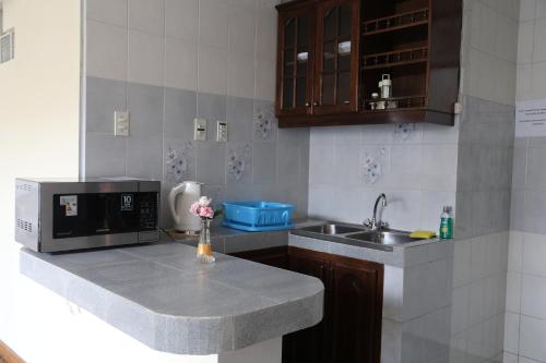 Kuchyň nebo kuchyňský kout v ubytování Alcalá Apart Hotel