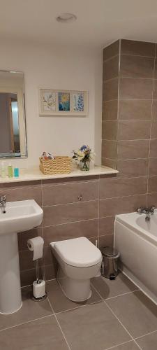 a bathroom with a toilet and a sink at Chavasse Apartments L15DX in Liverpool