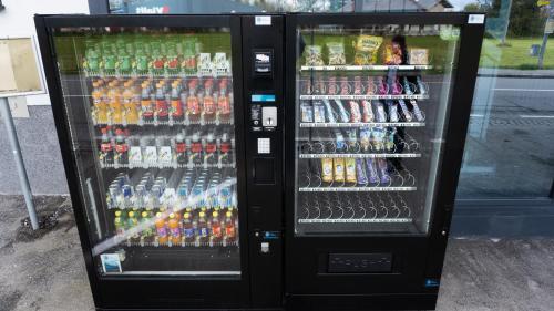 a vending machine filled with lots of drinks at PARKHOTEL BRAUNAU - 24 Stunden Self Check-IN in Braunau am Inn