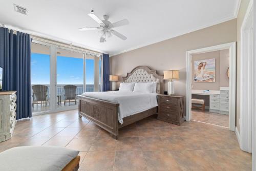 a large bedroom with a bed and a balcony at La Playa 1202 in Perdido Key