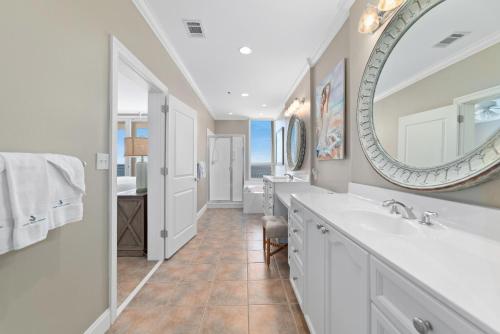 a bathroom with a sink and a mirror at La Playa 1202 in Perdido Key