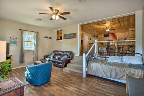 a living room with a bed and a couch at Kingston Getaway Less Than 2 Mi to Lake Texoma! in Kingston