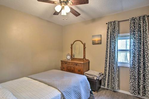 a bedroom with a bed and a ceiling fan at Kingston Getaway Less Than 2 Mi to Lake Texoma! in Kingston