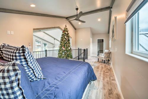 a bedroom with a christmas tree and a bed at Pine Cabin with Hot Tub and Mountain Views in Pine