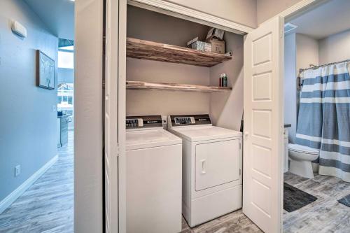 a small laundry room with a washer and dryer at Pine Cabin with Hot Tub and Mountain Views in Pine