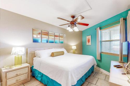 a bedroom with a bed and a ceiling fan at Perdido Sun 612 in Perdido Key