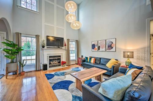 a living room with a couch and a table at Tranquil Greensboro Home with Fire Pit! in Greensboro