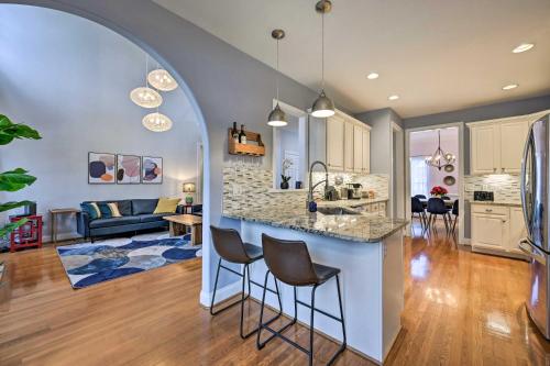 an open kitchen and living room with an archway at Tranquil Greensboro Home with Fire Pit! in Greensboro