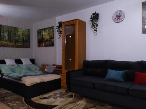 a living room with two couches and a couch at Mieszkanie w Centrum Chełma in Chełm