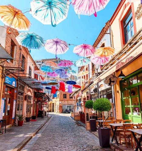 a street with umbrellas hanging over a street at Villa Joanna 2 in Thessaloniki