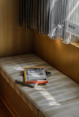 Postel nebo postele na pokoji v ubytování Mei Hotel