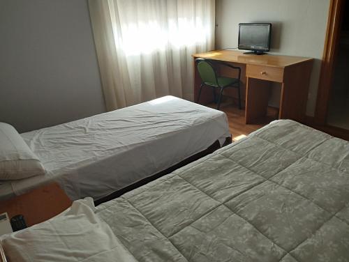 Krevet ili kreveti u jedinici u okviru objekta Hostal el Mirador de Barasoain