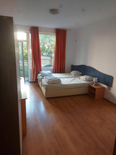 A bed or beds in a room at Studio and 1bedroom apartment Burgas - Economy