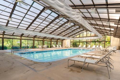 a large indoor pool with a glass ceiling at The Villas at French Lick Springs in French Lick